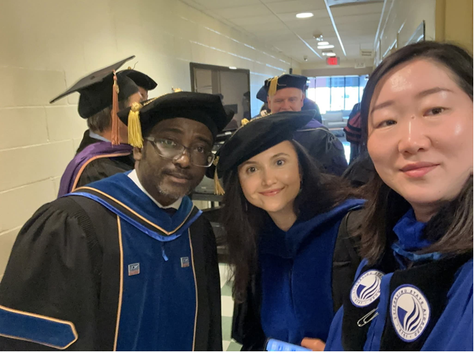 Adewale Ashogbon with academic colleagues in graduation regalia
